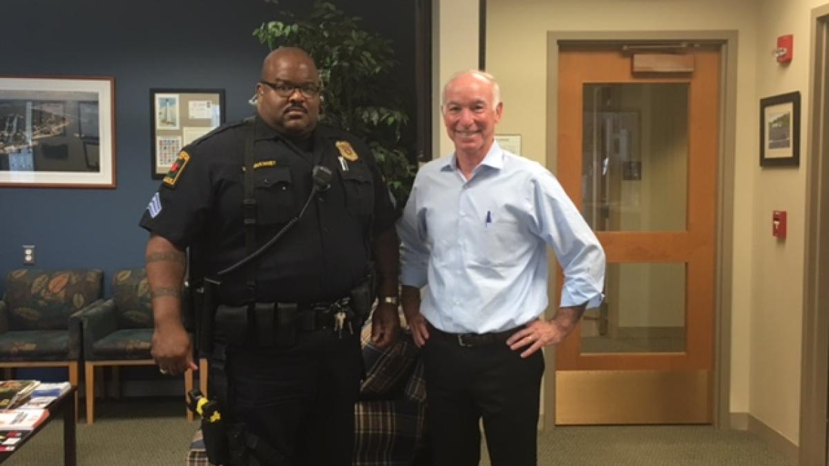 Courtney poses with Sergeant McKinney before joining him for a ride along
