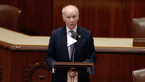 An image of Rep. Joe Courtney speaking on the House floor with a play button overlayed.