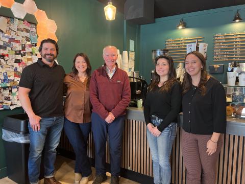 Rep. Joe Courtney stands with Two Dogs Coffee owners Gwilym Clark and Brittany Clark, Northeastern CT Chamber of Commerce Board Member and VP Internal Operations for A. Reynolds Electric LLC Jennifer Reynolds, and Executive Director of the Northeastern CT Chamber of Commerce Elle-Jordyn Sherman.