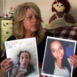 Jennifer Kelly holds photos of her 22 year old daughter Justice Croutch at her home in Tolland