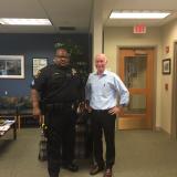 Courtney poses with Sergeant McKinney before joining him for a ride along